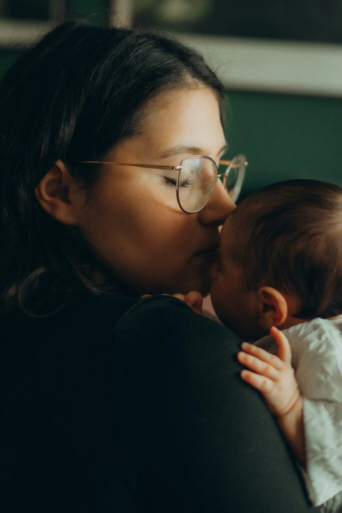 Mother holding her newborn close